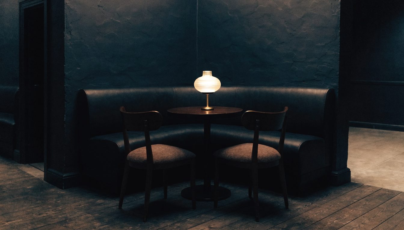 Quiet restaurant booth after hours suggesting a confidential conversation (illustrative)