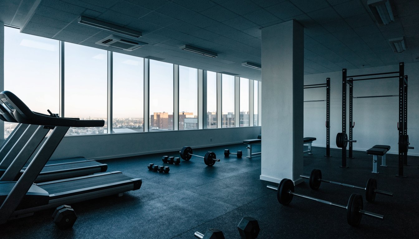 Condominium amenity floor fitness room overlooking the city