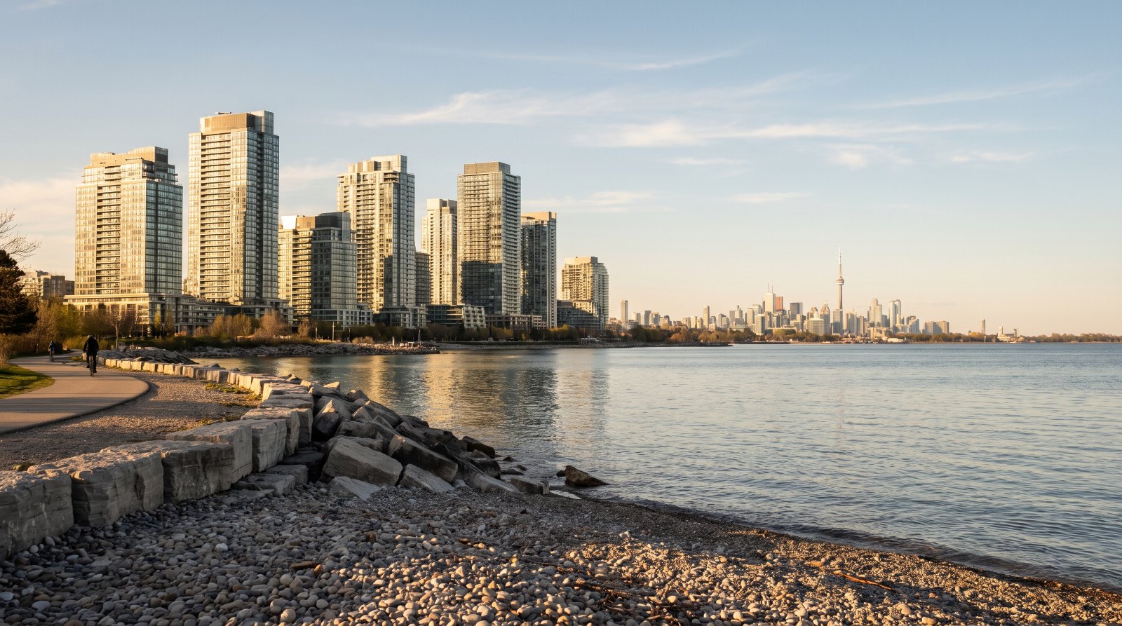 Humber Bay Shores condominium towers in Etobicoke, Toronto, seen at golden hour across Lake Ontario from the armourstone shoreline of Humber Bay Park East