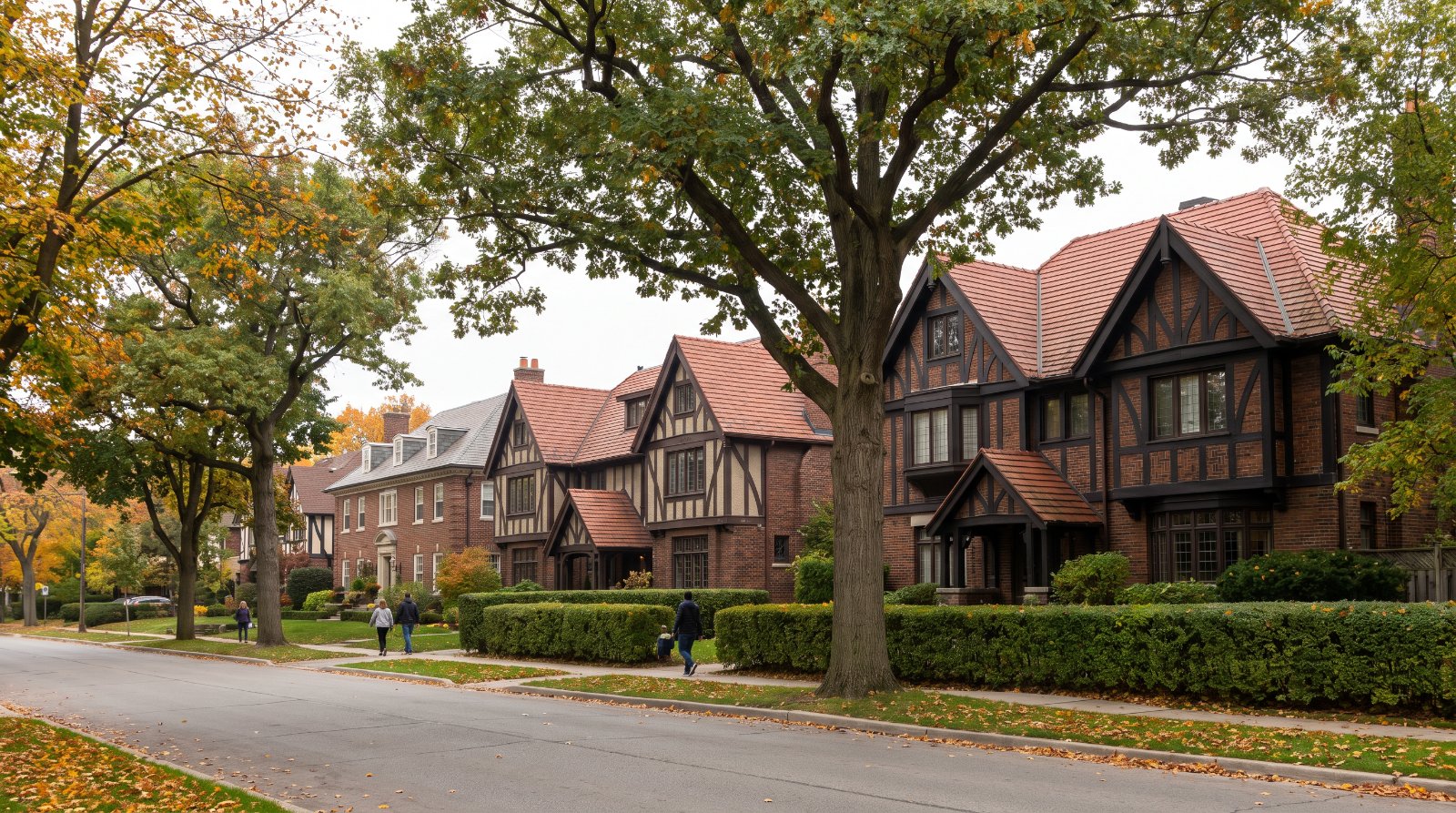 Large Tudor-revival brick homes on a tree-lined street in The Kingsway, Etobicoke