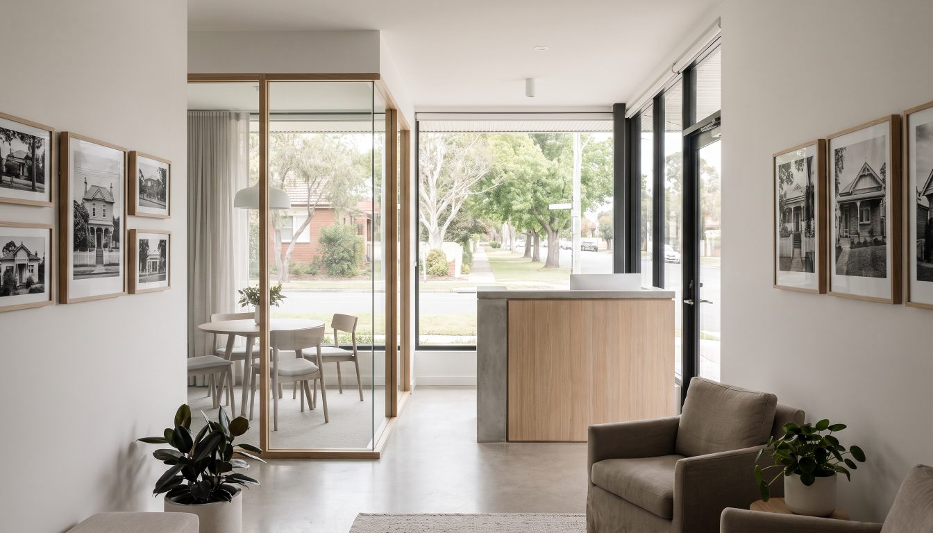 Small modern real estate brokerage office interior with a storefront window (illustrative)