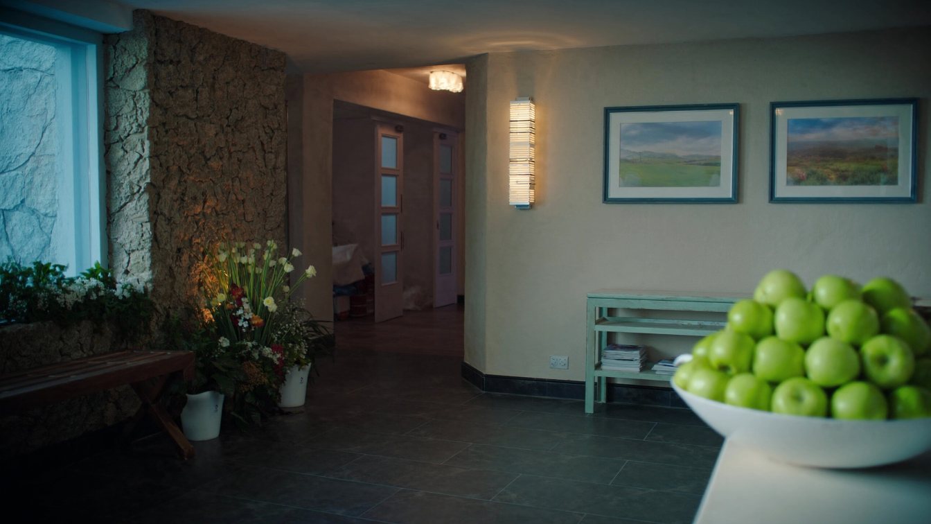 Quiet day spa reception with stone accents, plants and a corridor to treatment rooms in a GTA plaza (illustrative)