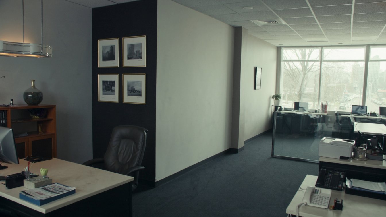 Quiet ground-floor financial services office with desks and meeting room on a GTA commercial street (illustrative)