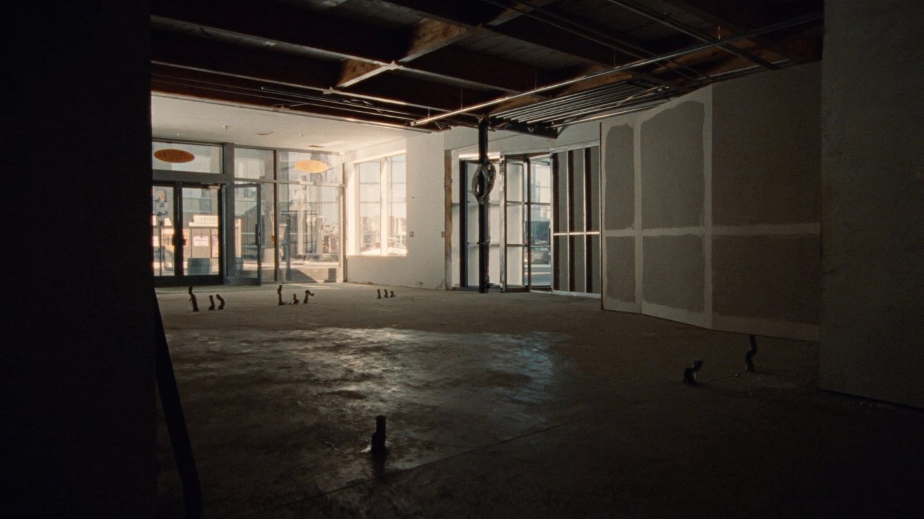 Empty plaza retail unit with plumbing rough-ins ready for a spa fit-out in the GTA (illustrative)