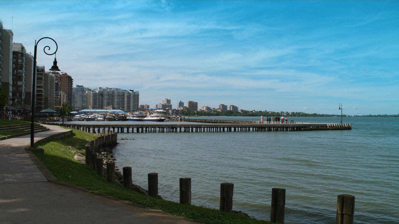 Condominium towers above the Burlington waterfront park and Lake Ontario shoreline (illustrative)