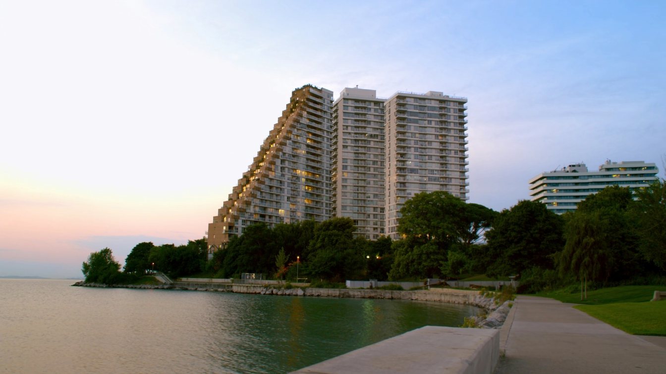 Condominium towers along the Humber Bay Shores waterfront in Etobicoke at dusk (illustrative)