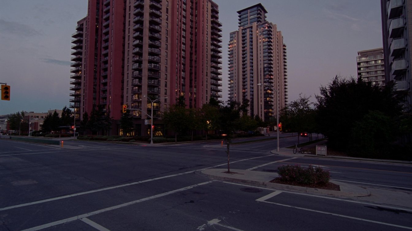 Midtown Toronto condominium towers along Yonge Street near Eglinton at dusk (illustrative)