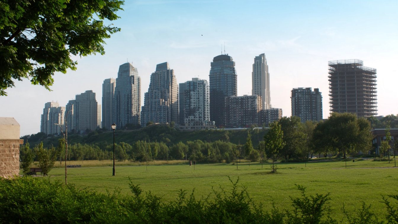Condominium towers along Yonge Street in North York seen from a park