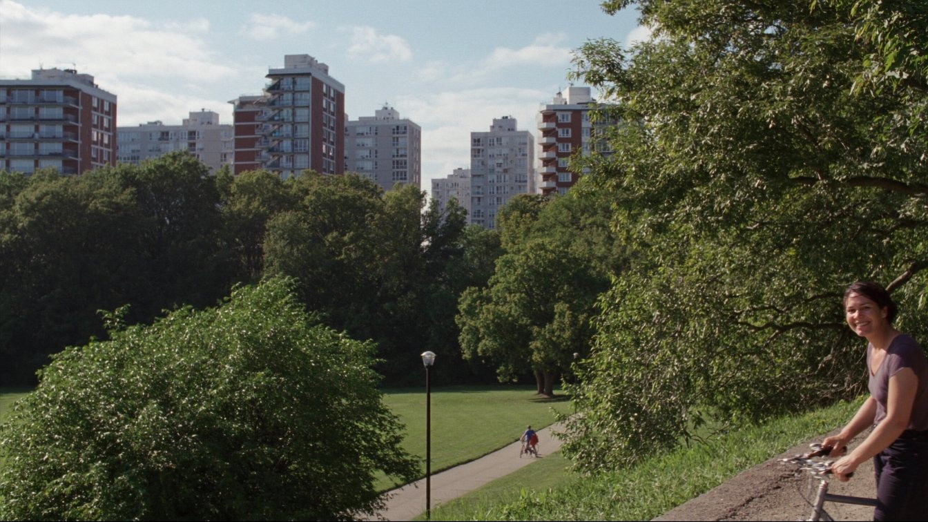 Condominium towers in Scarborough beside a green ravine park (illustrative)