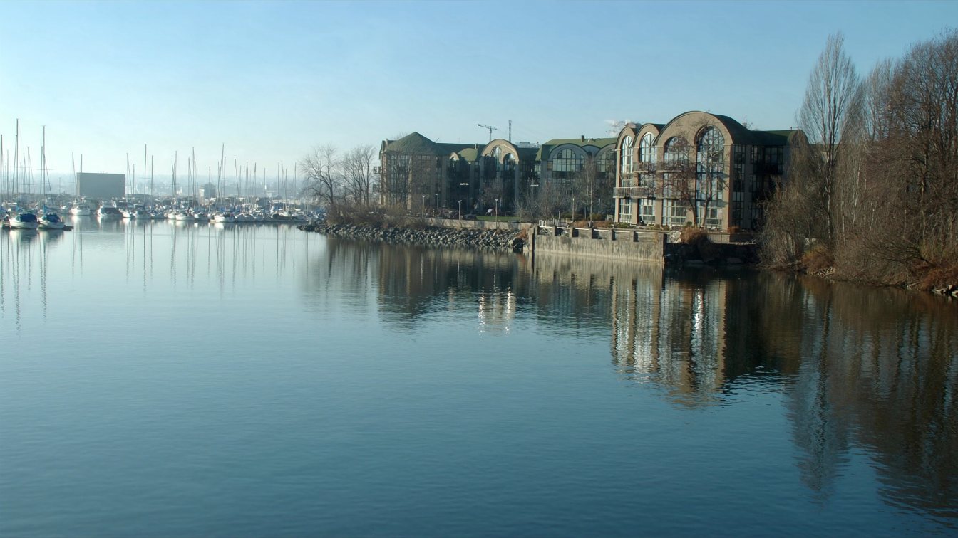 Marina and low-rise condominium buildings on the Lake Ontario shore in Durham Region (illustrative)