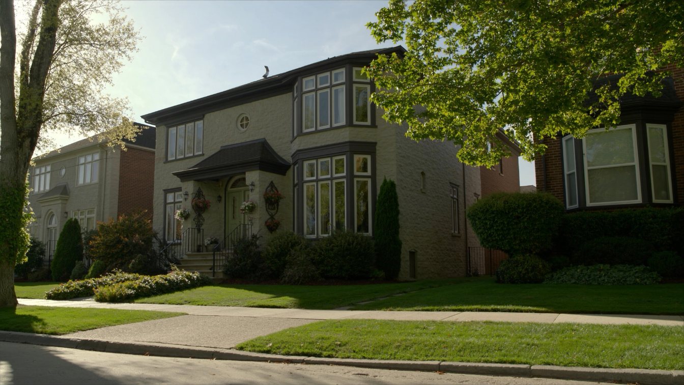 Large two-storey stone and brick detached houses on a curving residential street in Richmond Hill (illustrative)