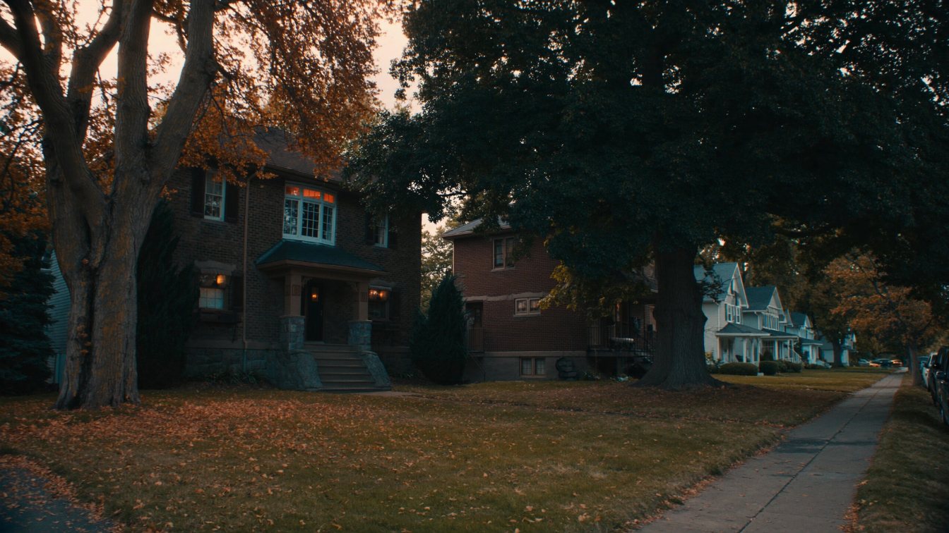 Older brick detached houses with deep front yards on a mature tree-lined street in Durham Region (illustrative)