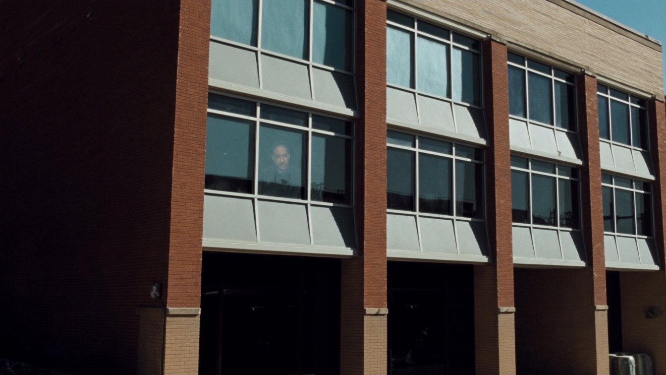 Second-floor professional units above shops on a Toronto main street, a common location for massage therapy clinics (illustrative)