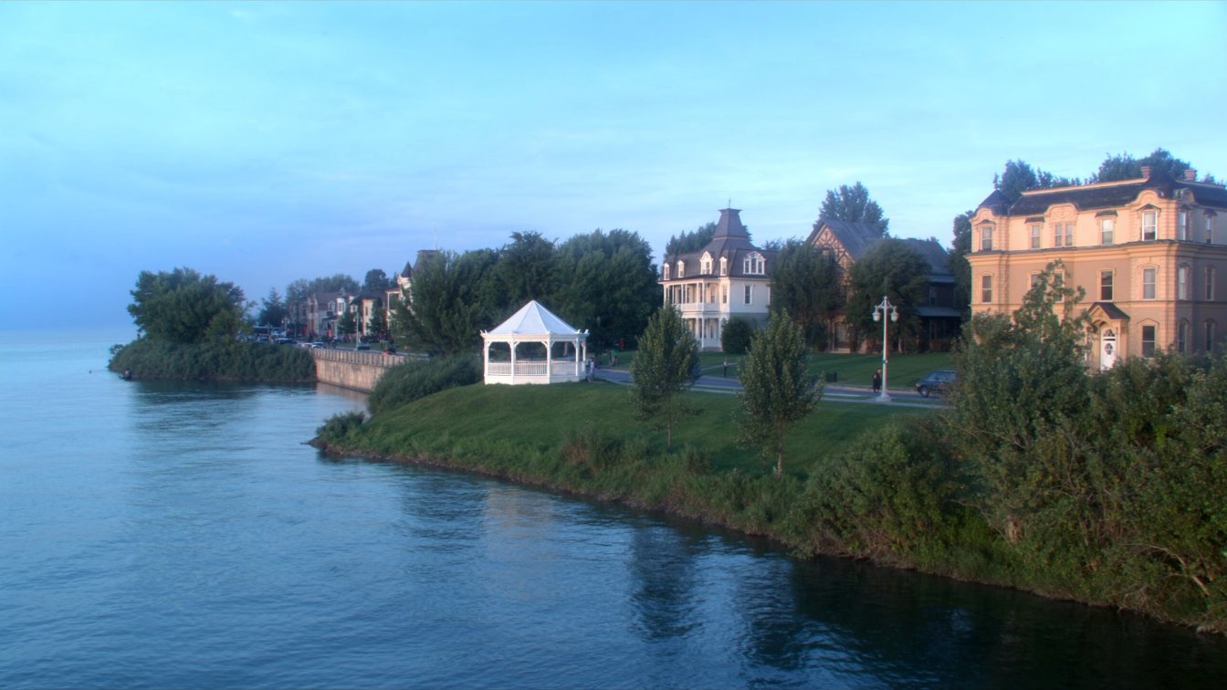 Historic lakeside town with a gazebo in a waterfront park where a wide river meets Lake Ontario at Niagara-on-the-Lake (illustrative)