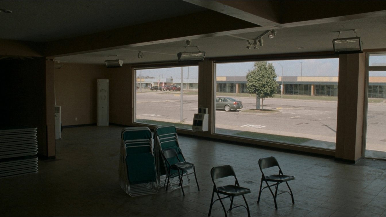 Ground-floor commercial unit with large windows in a GTA plaza, suited to an optometry clinic fit-out (illustrative)