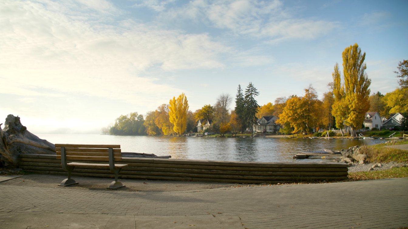 Waterfront trail along a wide blue bay on Lake Simcoe on a clear autumn morning (illustrative)