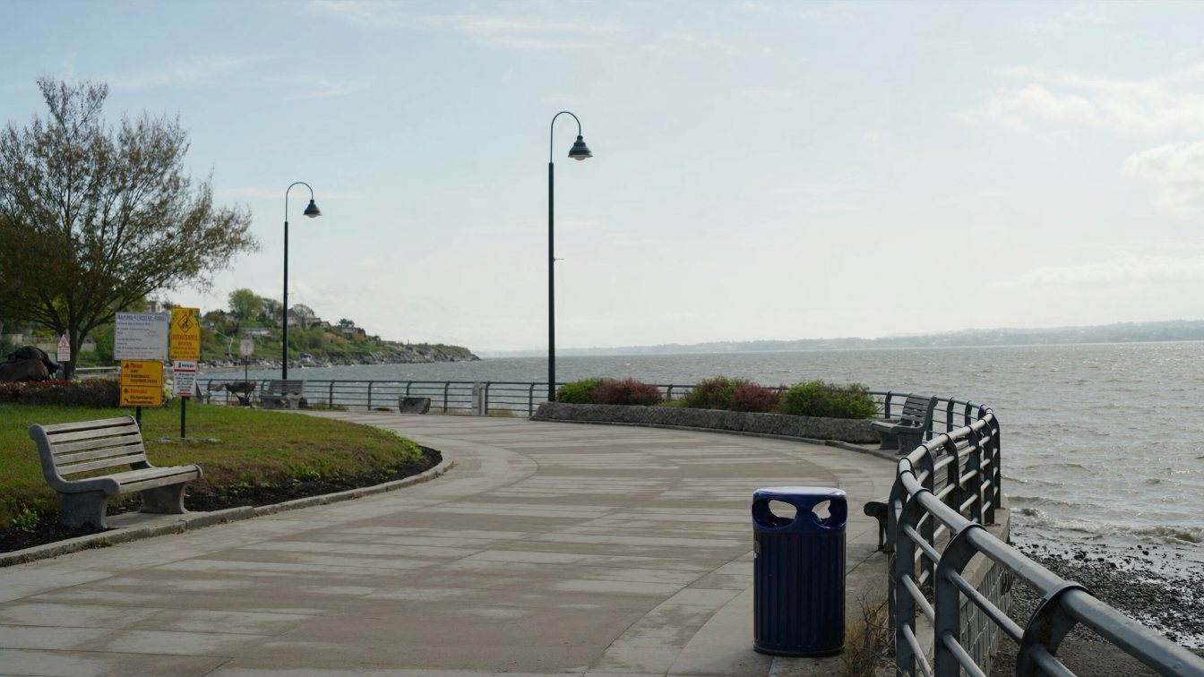 Lakefront promenade in Burlington, Ontario, with benches facing Lake Ontario in early autumn (illustrative)