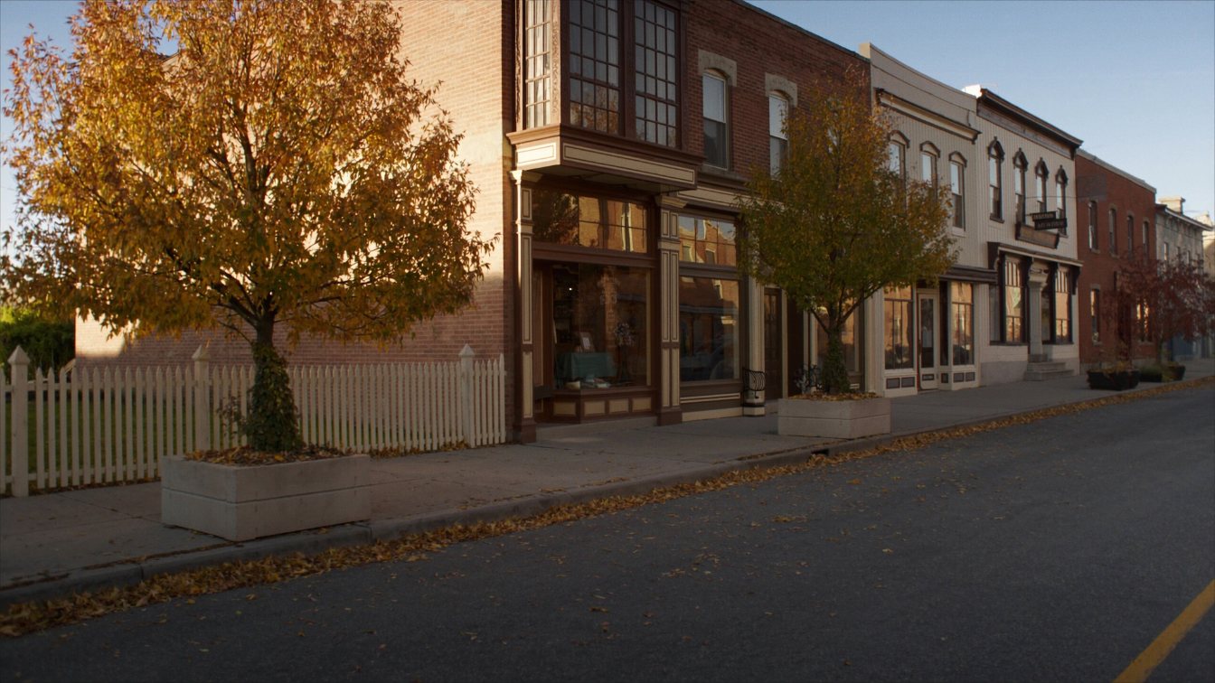 Historic main street with low brick storefronts and autumn trees in a GTA village (illustrative)