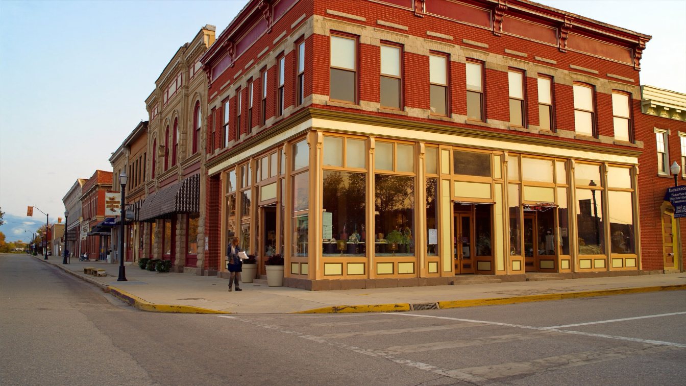 Small-town main street with heritage brick buildings and autumn colour north of Toronto (illustrative)