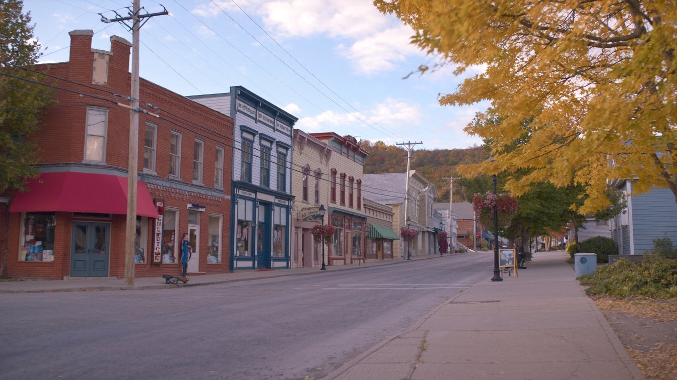 Quiet tree-lined main street in a historic Ontario lakeside town in early autumn (illustrative)