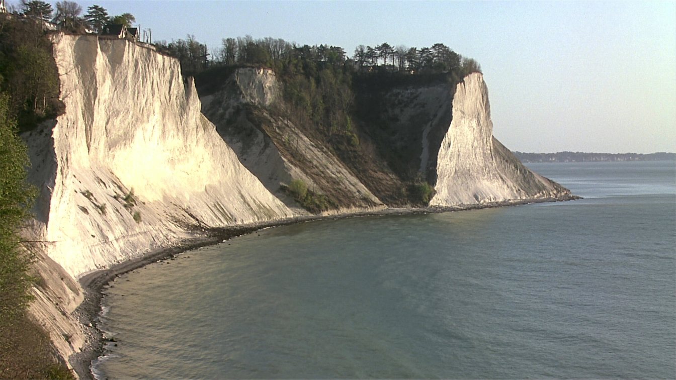 Tall clay bluffs above Lake Ontario with houses set back along the top in Scarborough (illustrative)