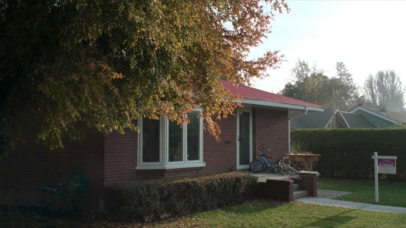 Detached brick bungalow on a quiet Toronto street with autumn trees (illustrative)