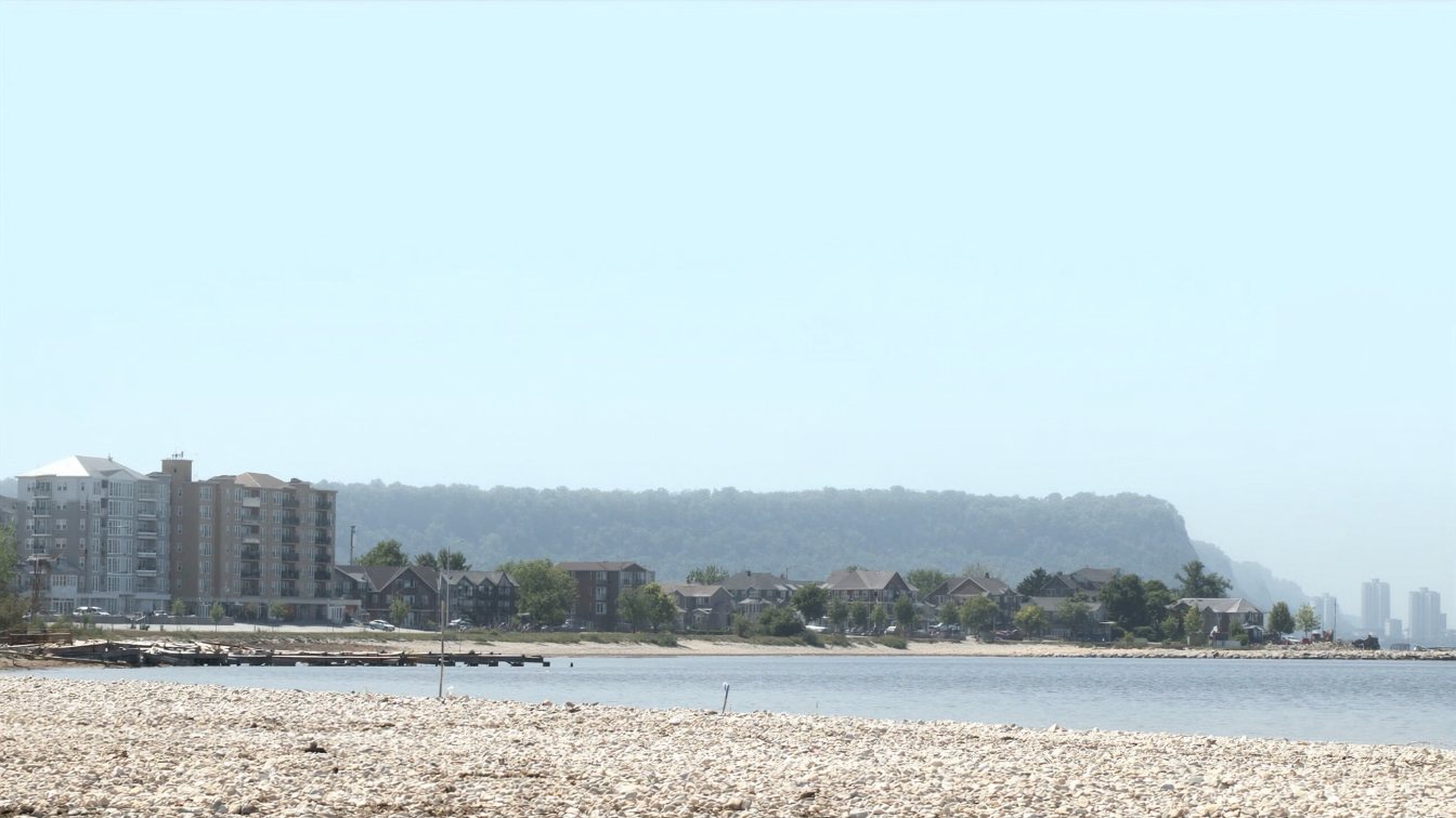 Low-rise condominium near a lakeshore road (illustrative of the area)
