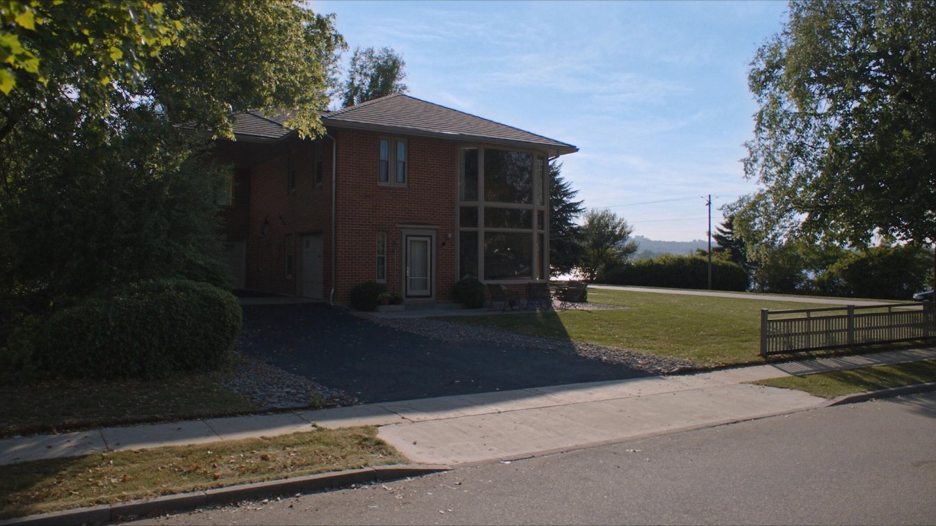 Post-war detached house on a treed lot two streets from a Lake Ontario beach in Durham Region (illustrative)