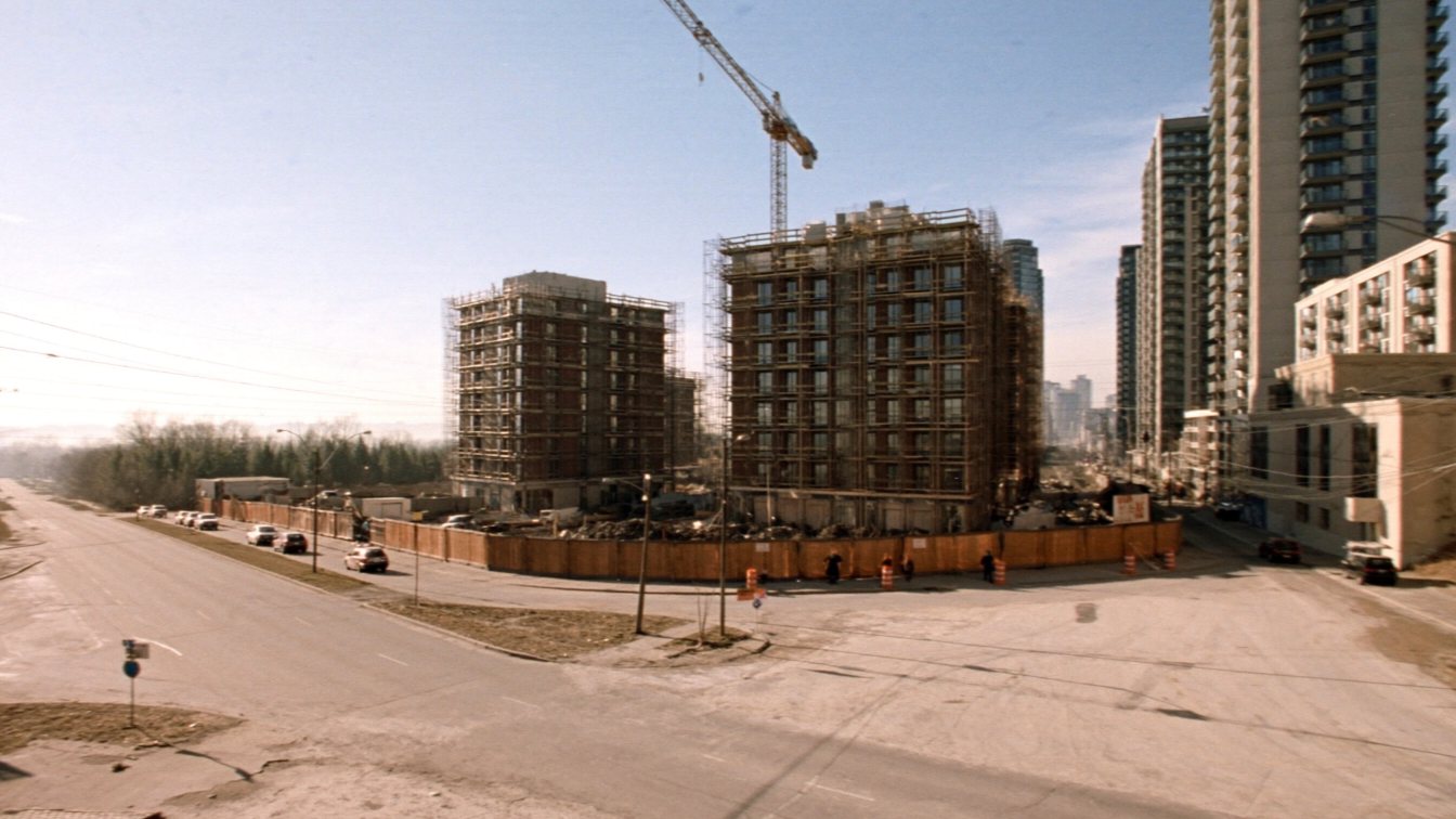 Mid-rise buildings under construction on The Queensway (illustrative)
