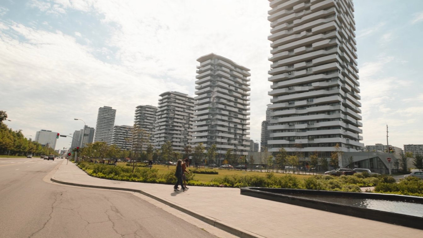 New residential towers with a landscaped plaza (illustrative)