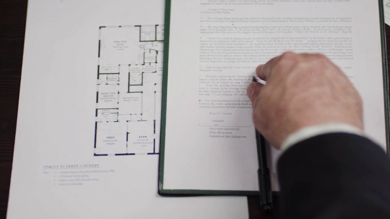 Reviewing a contract clause beside a condo floor plan (illustrative)