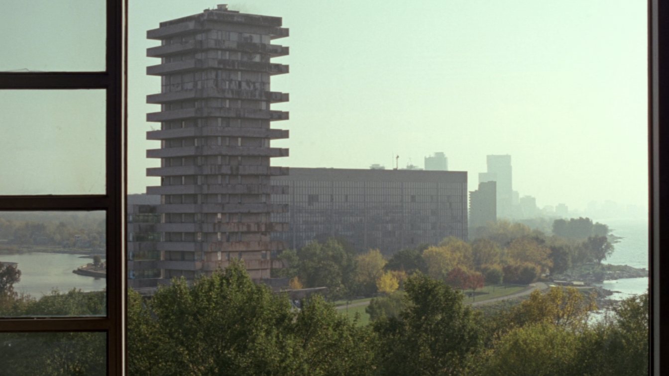 Early-2000s waterfront condo tower beside a lakefront park in Etobicoke (illustrative)