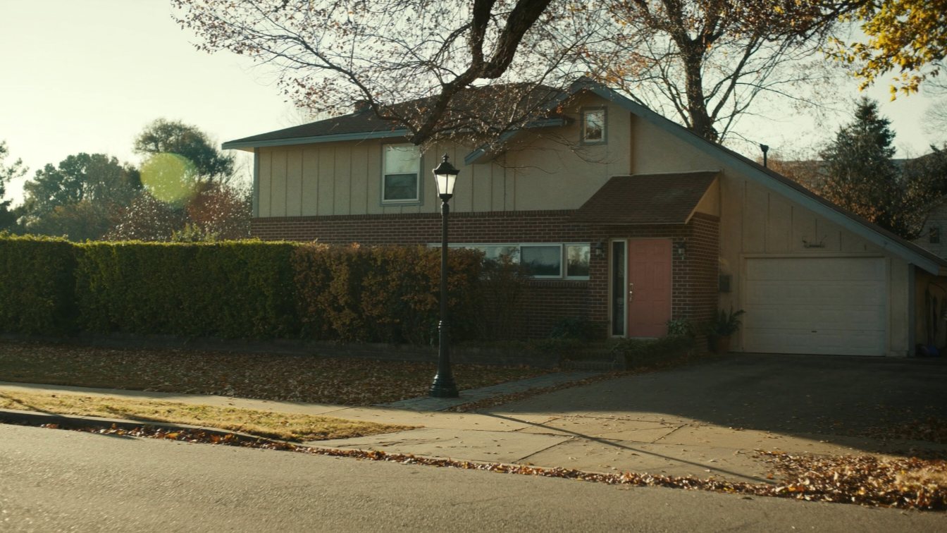 Newcomer couple holding keys outside a GTA townhouse (illustrative)