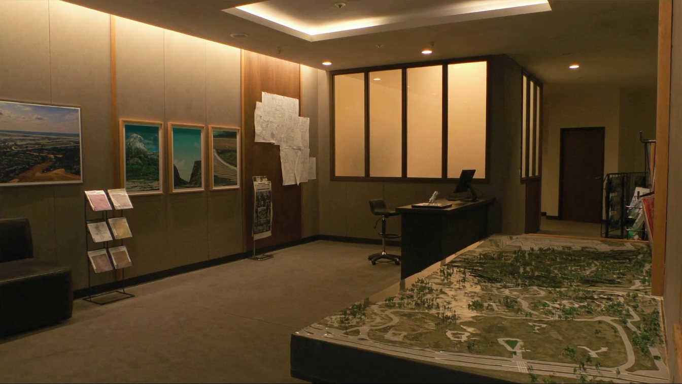 New-home sales centre with a scale model of a subdivision (illustrative)