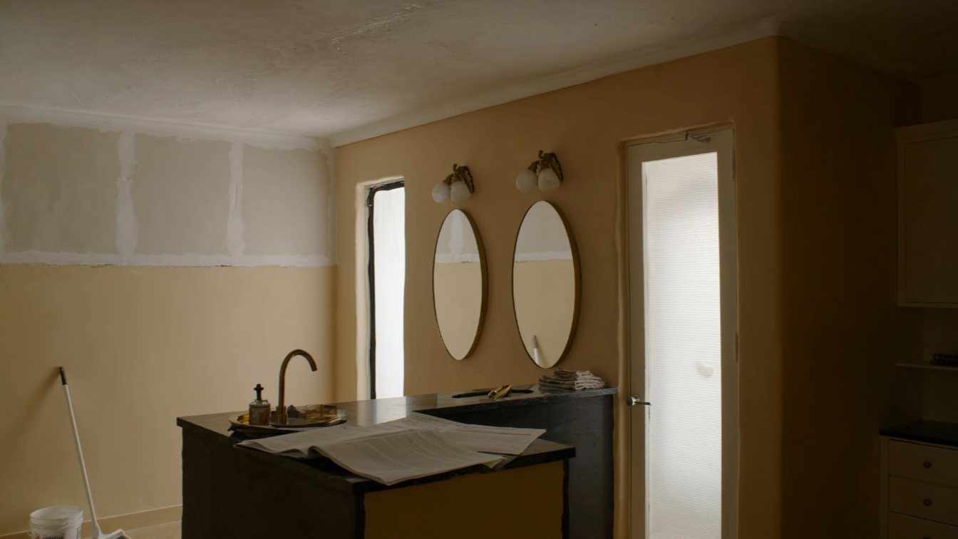 Water damage in a condo bathroom with insurance papers (illustrative)