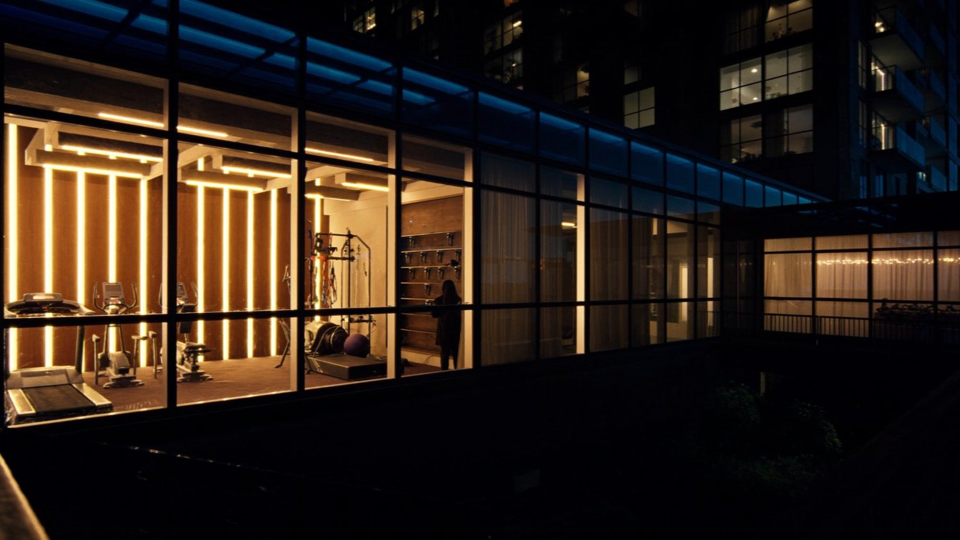 Condo amenity floor with gym and party room (illustrative)