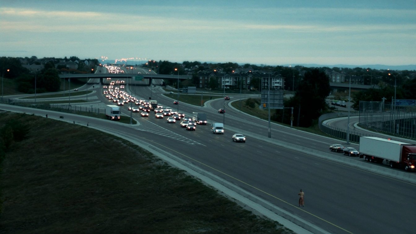 Highway 427 interchange between Etobicoke and Mississauga at dusk (illustrative)