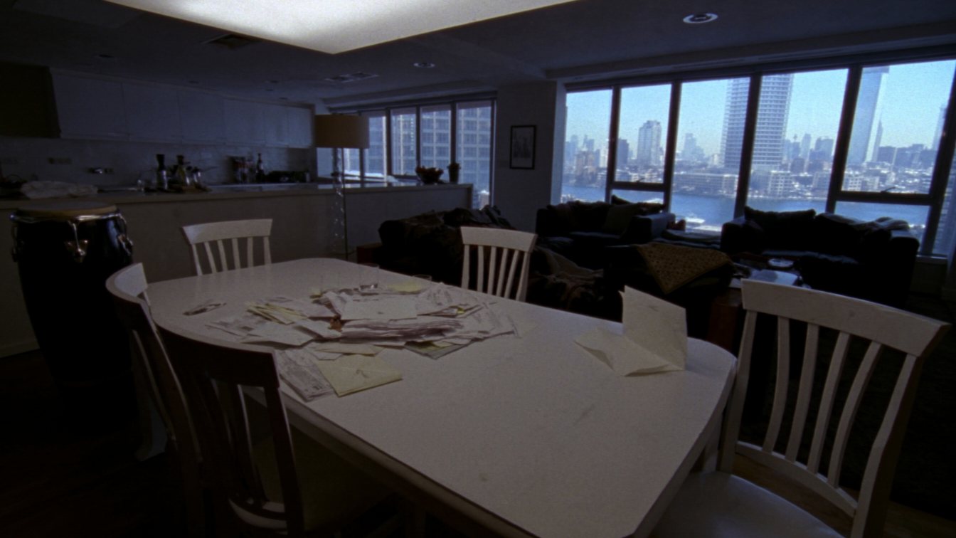 Large condo suite with a lake view and fee statements on the table (illustrative)