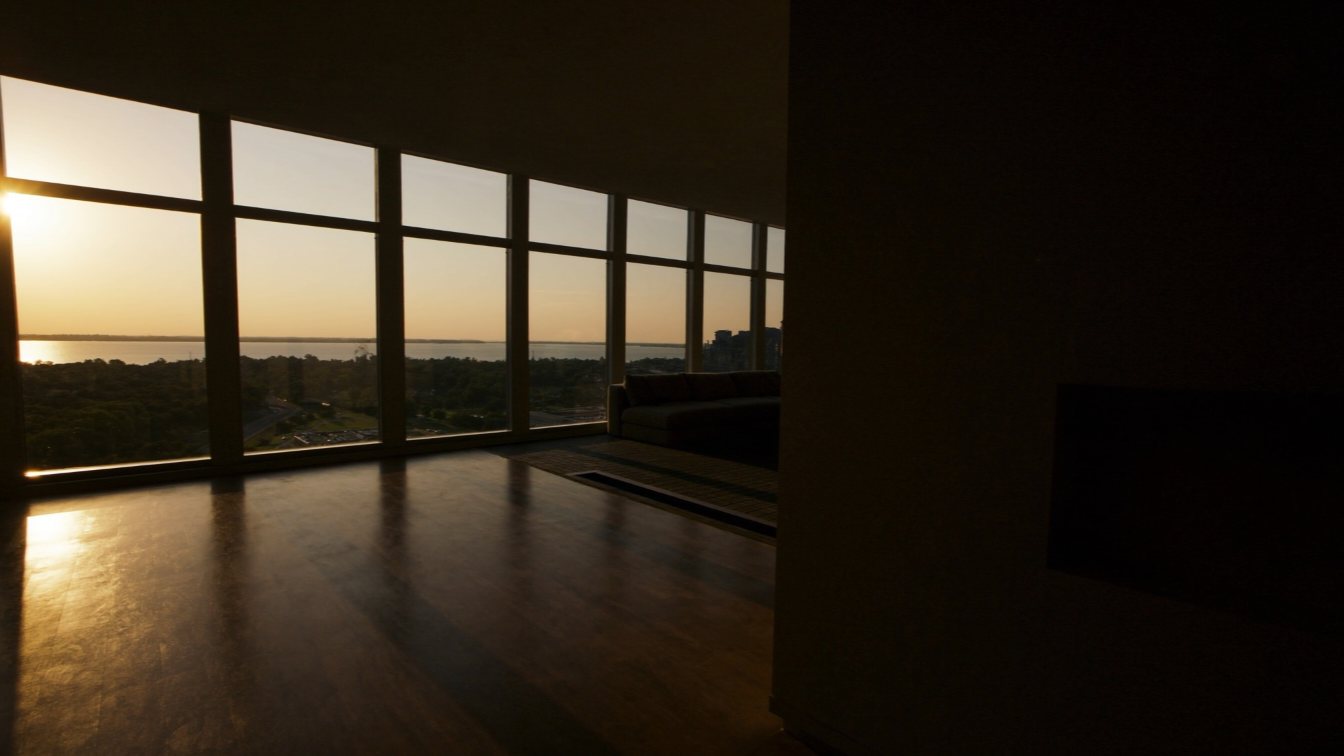 Spacious condo living room overlooking Lake Ontario (illustrative)