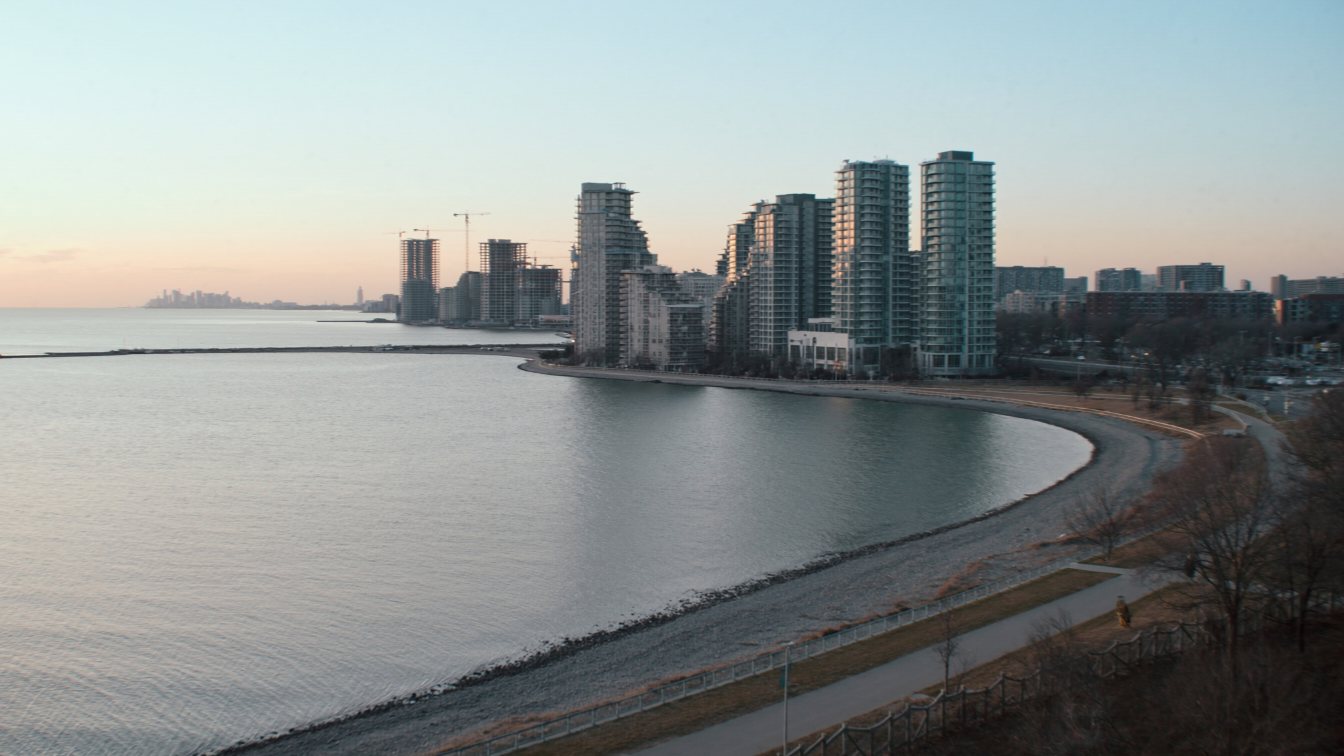Waterfront condo towers seen from the Humber Bay shoreline trail (illustrative)
