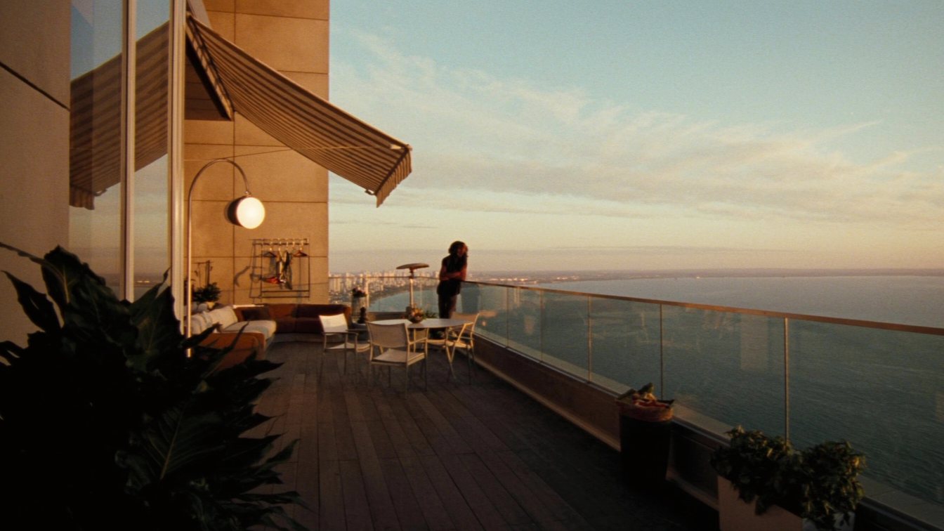 Penthouse terrace above Lake Ontario with the Toronto skyline (illustrative)