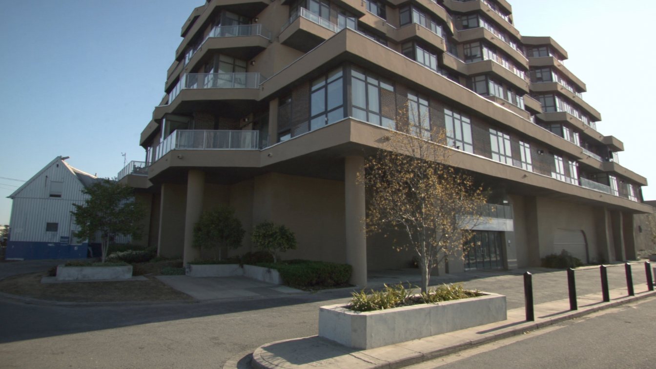 Contemporary stepped mid-rise condo on The Queensway (illustrative)