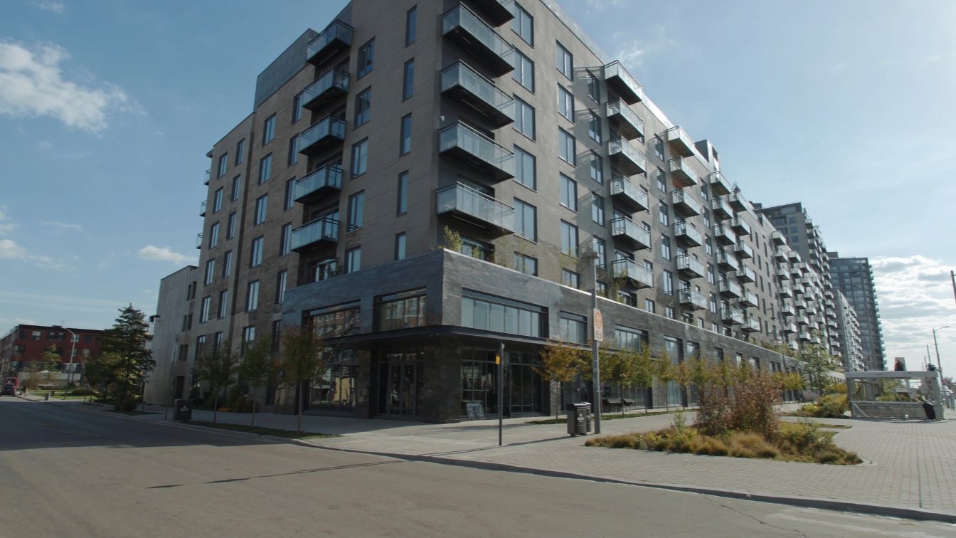 Modern mid-rise residential building on The Queensway (illustrative)