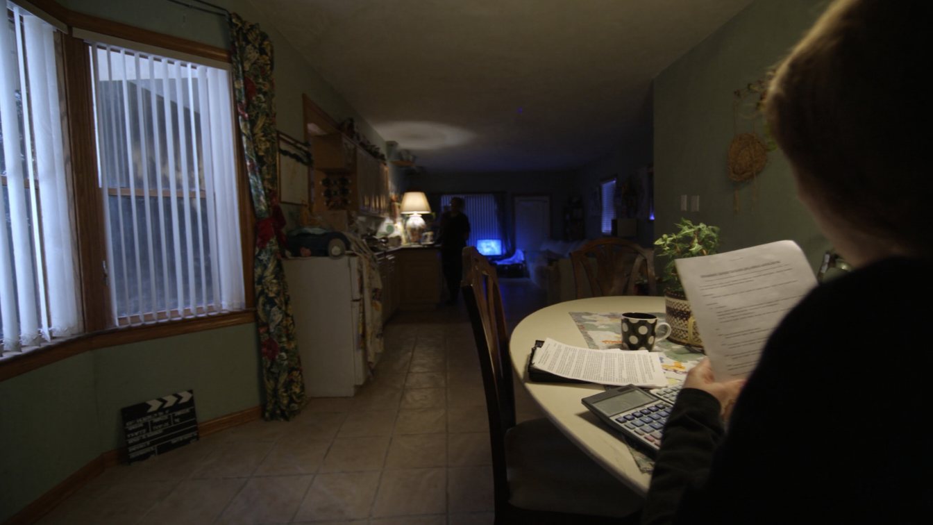 Homeowner reviewing a mortgage renewal letter (illustrative)
