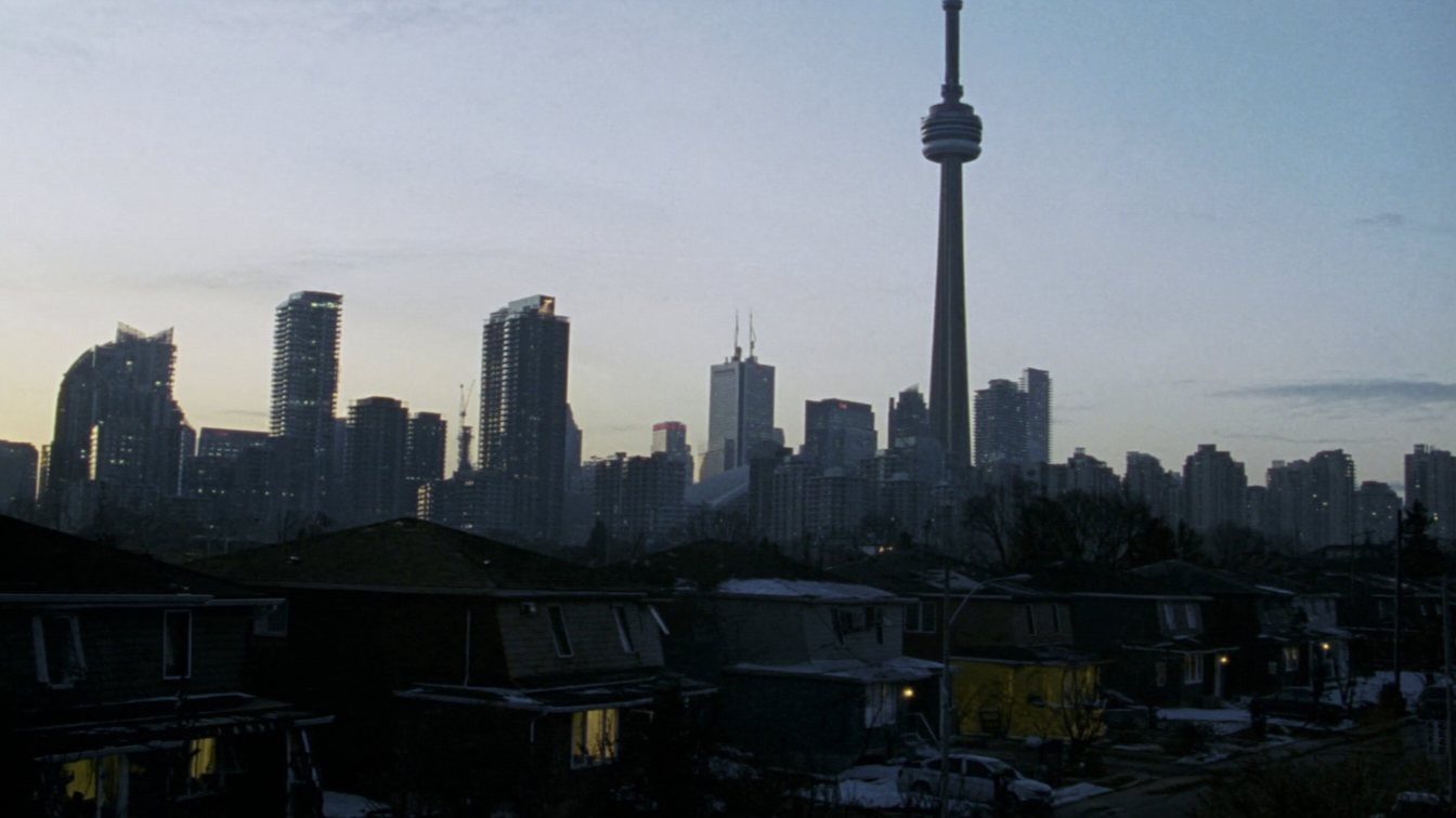 Toronto skyline beyond a residential neighbourhood (illustrative)