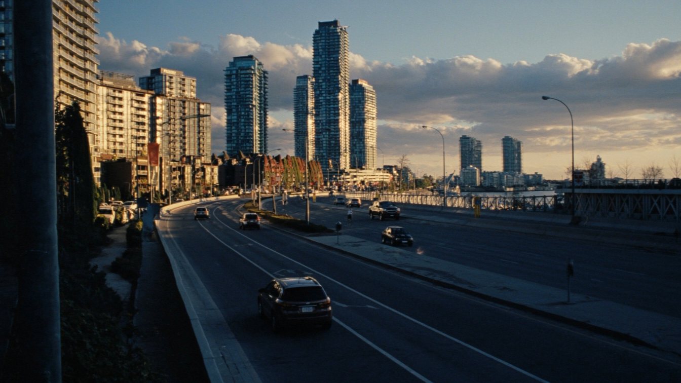 Busy road between waterfront condo towers in Etobicoke (illustrative)