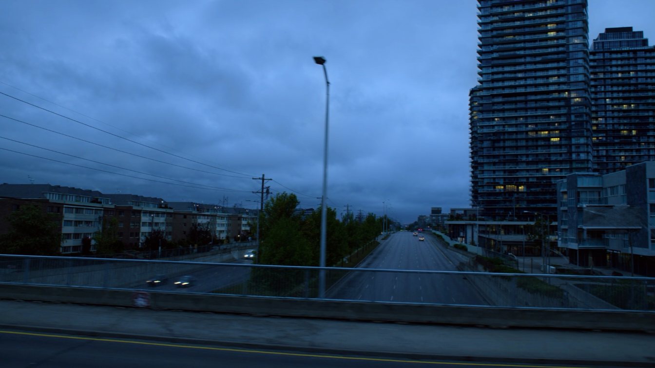 Condo buildings along The Queensway at dusk (illustrative)