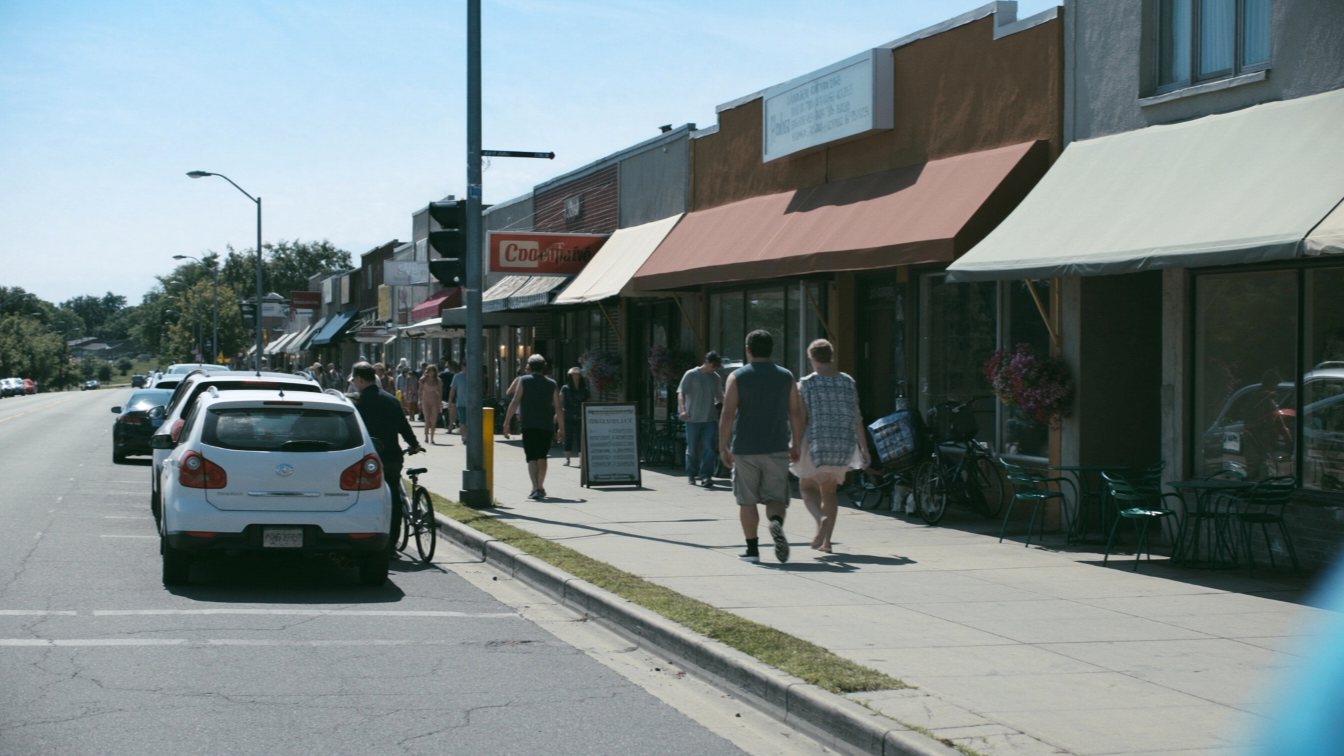 Shops and cafes along The Queensway (illustrative)