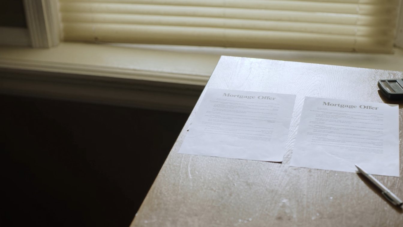 Comparing two mortgage offers on a desk (illustrative)