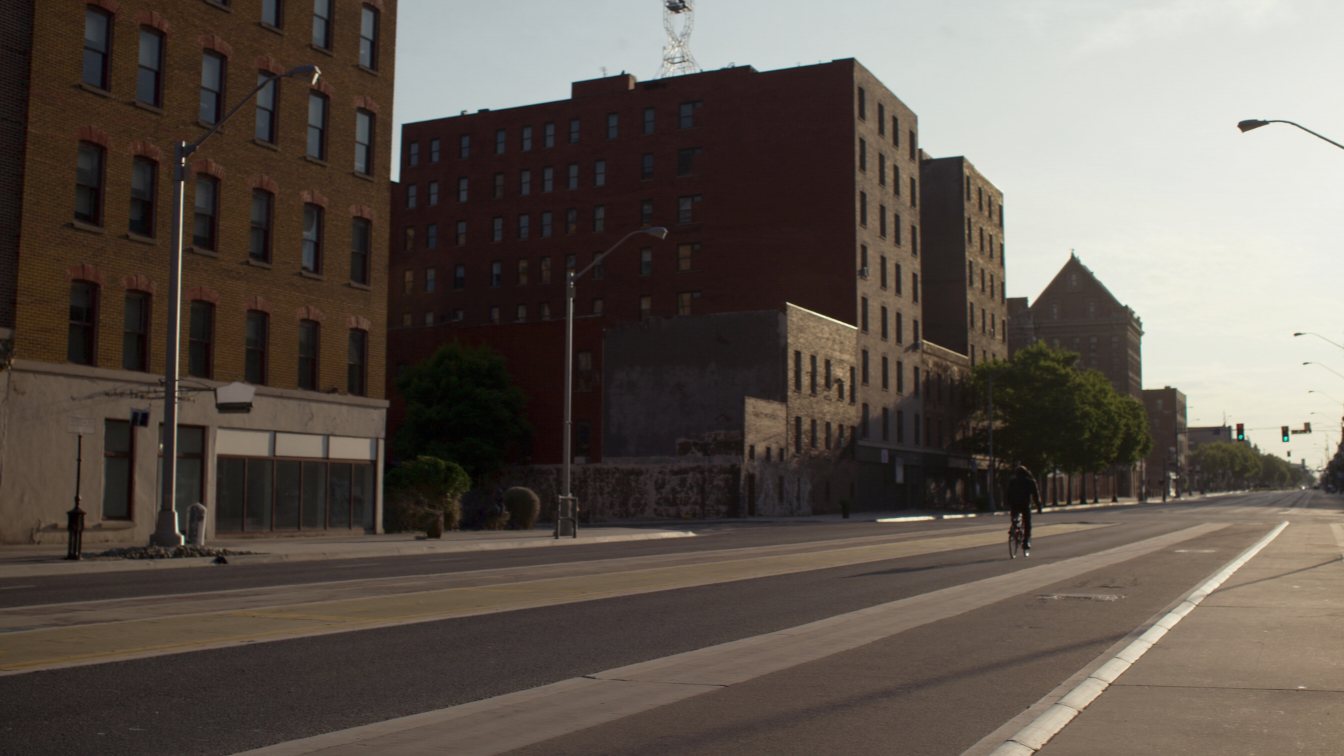 Protected bike lane on a wide Toronto avenue (illustrative)